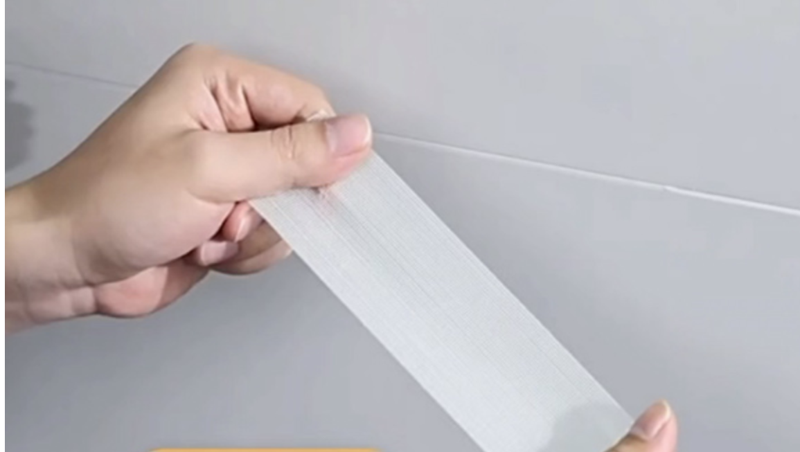 Transparent mesh-tygbaserad dubbelsidig tejp
